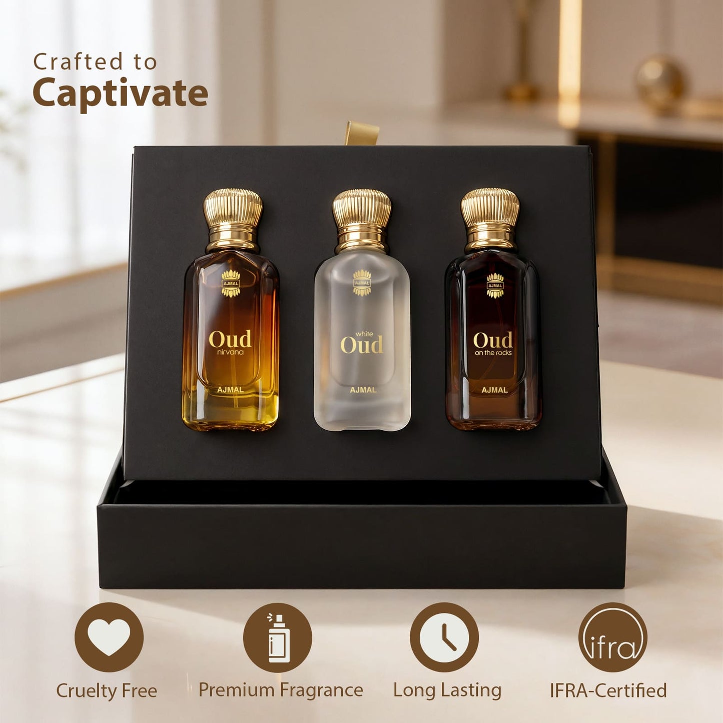 Three perfume bottles from A'NIA Oud Collection displayed inside a black gift box, with the text 'Crafted to Captivate' and four feature icons at the bottom.